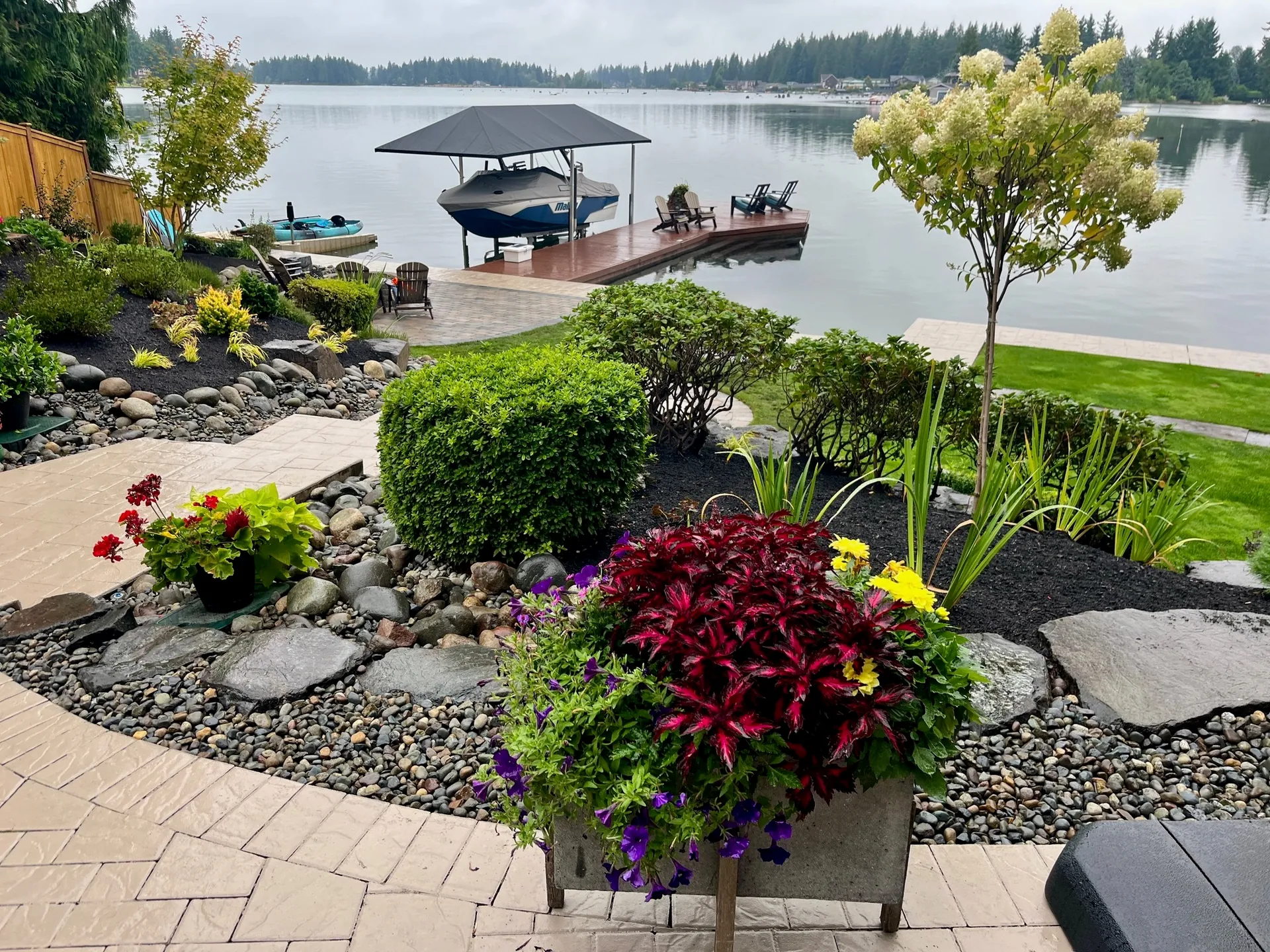 Lakefront landscape design with dock and hydrangeas in Puyallup WA